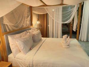 Ένα ή περισσότερα κρεβάτια σε δωμάτιο στο The Moonci Ubud by EPS