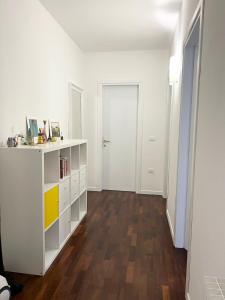 an empty room with a white shelf and a door at Apartment near Treviso in Silea in Silea