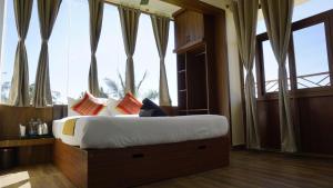 Ένα ή περισσότερα κρεβάτια σε δωμάτιο στο AT CKM Homestay