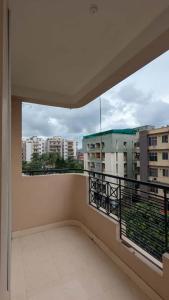 a balcony with a view of a building at Seneh Homes in Guwahati +28 photos