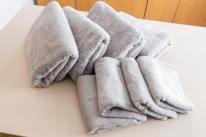 a pile of towels sitting on top of a table at Ayame Building in Tokyo