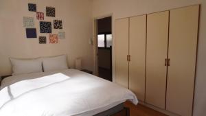 Ένα ή περισσότερα κρεβάτια σε δωμάτιο στο Ikebukuro