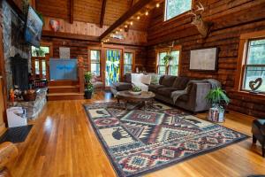 a living room with a couch and a rug at Perfect Family Cabin 3 Bedrooms in Northfield +45 photos