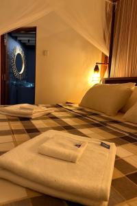 Postel nebo postele na pokoji v ubytování Pepper Hills Hostel & Cottages