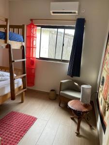 Ένα ή περισσότερα κρεβάτια σε δωμάτιο στο Casa Baleia Azul 8A Ponta Mamoli +11 φωτογραφίες