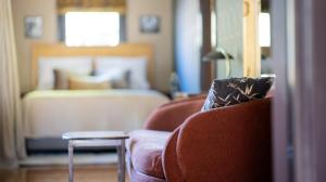 Ένα ή περισσότερα κρεβάτια σε δωμάτιο στο Wilson's Guest House