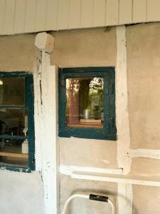 a window on the side of a building with a sink at Quiet Hideaway Surrounded By Nature in Vesterborg