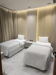 Voodi või voodid majutusasutuse أركان ونس للشقق المخدومة toas