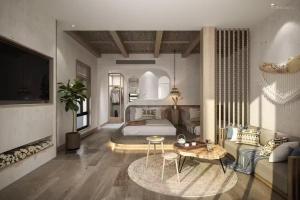 a large bedroom with a bed and a table at Fuxian Lake Lanshan Su Ant Nest Homestay in Xujiadu