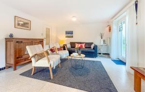 a living room with a couch and a table at 1 Bedroom Nice Apartment In De Panne in De Panne