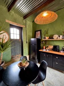 a kitchen with a table and a kitchen with a refrigerator at One Eye Dog in Koringberg +22 photos