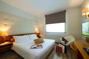 Postel nebo postele na pokoji v ubytování Castagna Palace Hotel & Restaurant + 31 fotografií