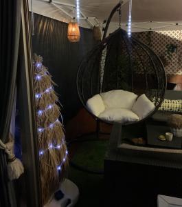 a hanging chair in a room with lights at Mar de Alcabre in Vigo