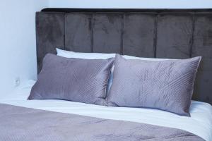 Postel nebo postele na pokoji v ubytování Wohnung IA - Modernes Twin-Apartment