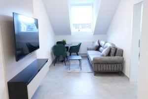 TV a/nebo společenská místnost v ubytování Wohnung IA - Modernes Twin-Apartment