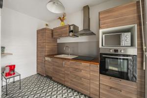 Η κουζίνα ή μικρή κουζίνα στο Cour de la Garonne -Proche Disneyland avec parking +4 φωτογραφίες