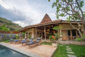 Bazén v ubytování Hita Joglo Villa nebo v jeho okolí