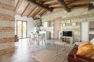 a living room with a couch and a table at Holiday Home Camino Monferrato in Camino
