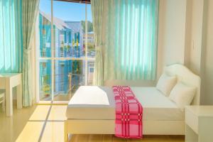 a bedroom with a bed and a large window at Hằng Hoa Hotel Đồng Nai in Dĩ An +26 photos