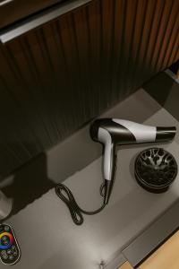 a kitchen sink with a faucet on a counter at Jungle Room Strasbourg - Évasion Tropicale - Sauna Jacuzzi Balnéo in Strasbourg