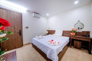 Postel nebo postele na pokoji v ubytování Thu Ha Hotel