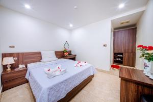 Postel nebo postele na pokoji v ubytování Thu Ha Hotel