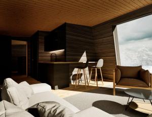 un salon avec un canapé et une table dans l'établissement Raitola Reindeer and Husky Farm- Panorama Lodges, à Rovaniemi