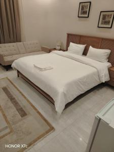 Ένα ή περισσότερα κρεβάτια σε δωμάτιο στο دادن 1 - Dadan 1