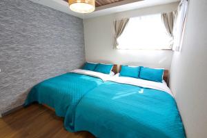 Postel nebo postele na pokoji v ubytování Villa de Mui nago Kaula A