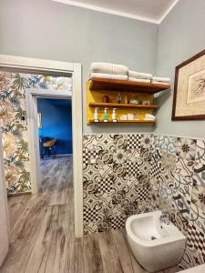 a bathroom with a sink and a mirror at AlCivico3 in Civitanova Marche +41 photos