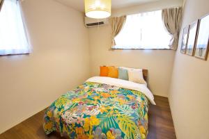 Postel nebo postele na pokoji v ubytování Villa de Mui nago Kaula A