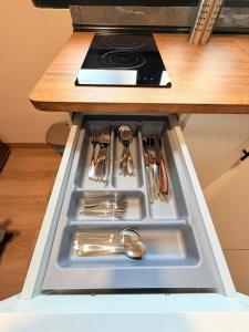 a drawer in a kitchen with utensils in it at TABLERO 101, coqueto y moderno estudio in El Tablero