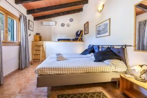 a bedroom with a bed in a room at Mercedes in Santa Margalida +16 photos