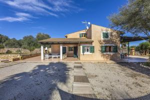 a house with a large driveway in front of it at Mercedes in Santa Margalida