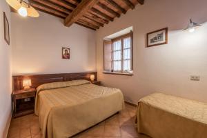 a bedroom with two beds and a window at Sarzana-Charming Apartment Pool and BB in Sarzana +22 photos
