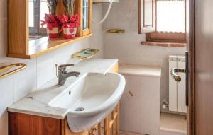 a bathroom with a sink and a window at Svasso Maggiore in Pucciarelli +15 photos