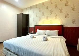 Ένα ή περισσότερα κρεβάτια σε δωμάτιο στο Swing & Pillows - Sky Star, KLIA 1 KLIA 2, Sepang