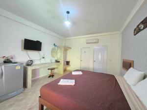 Ένα ή περισσότερα κρεβάτια σε δωμάτιο στο SK Hotel Phitsanulok