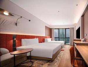 Postel nebo postele na pokoji v ubytování Hilton Garden Inn Chengdu East Railway Station + 98 fotografií