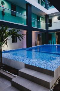 Bazén v ubytování Hotel Flamingo Merida nebo v jeho okolí