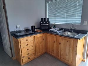 a kitchen with a sink and a counter top at Aqua Farm - Family Unit in Teba