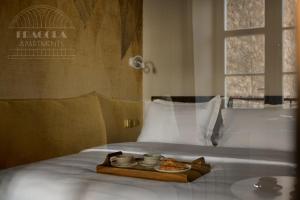 a tray of food sitting on top of a bed at Art Palace - Fragola Apartments in Kraków