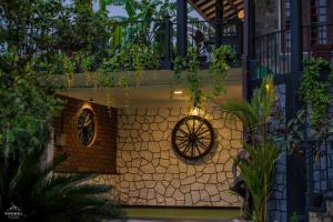 a building with a wall with a wheel on it at Winterfell Bandarawela in Bandarawela