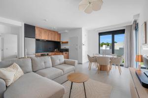a living room with a couch and a table at Casa Jette in San Miguel de Salinas