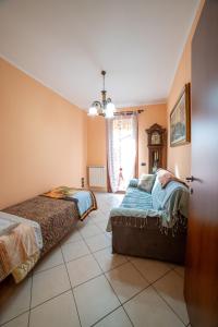 Ένα ή περισσότερα κρεβάτια σε δωμάτιο στο Residence dei fiori - Dimora Mery