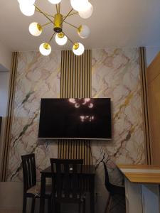 TV a/nebo společenská místnost v ubytování The Grass Residences