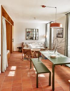 a living room with a table and a couch at Zámek Žďár in Žďár nad Sázavou