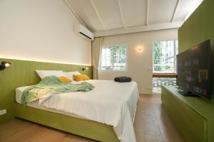 Ένα ή περισσότερα κρεβάτια σε δωμάτιο στο day one space - BTS On Nut - Live Above Cowork Cafe