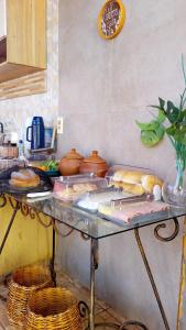 a table with a bunch of food on it at Pousada Villa Zarah in São Miguel do Gostoso