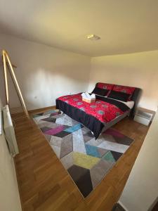 a bedroom with a bed with a colorful rug at Sunny Garden Old Town in Sarajevo